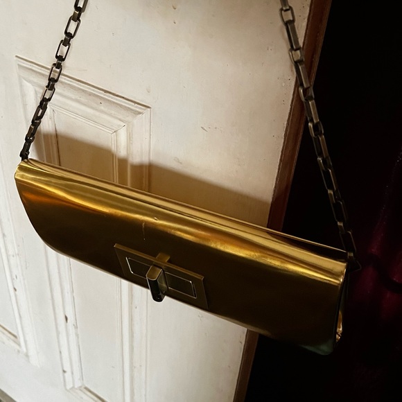NWT - Olga berg gold clutch bag. NWT. Comes with chain strap. Rectangular clasp. - Picture 10 of 15
